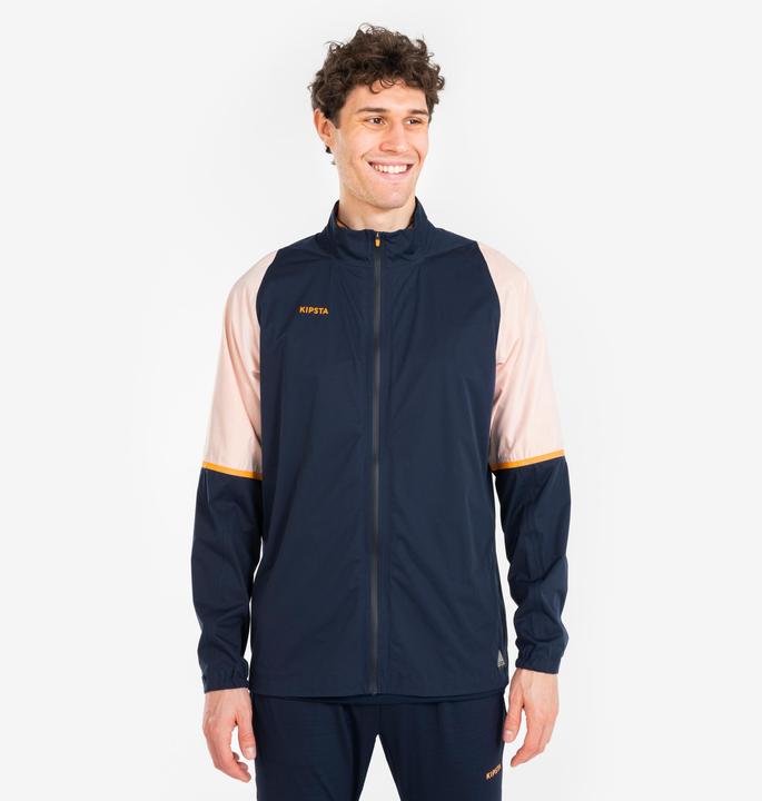 Produktbild Kipsta Damen/Herren Fussball Regenjacke - CLR marineblau/orange (XS)