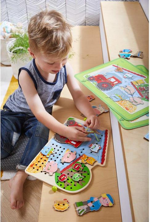 Produktbild Haba Fädelspiel Bauernhof (Französisch, Deutsch, Italienisch, Englisch, Niederländisch, Spanisch)