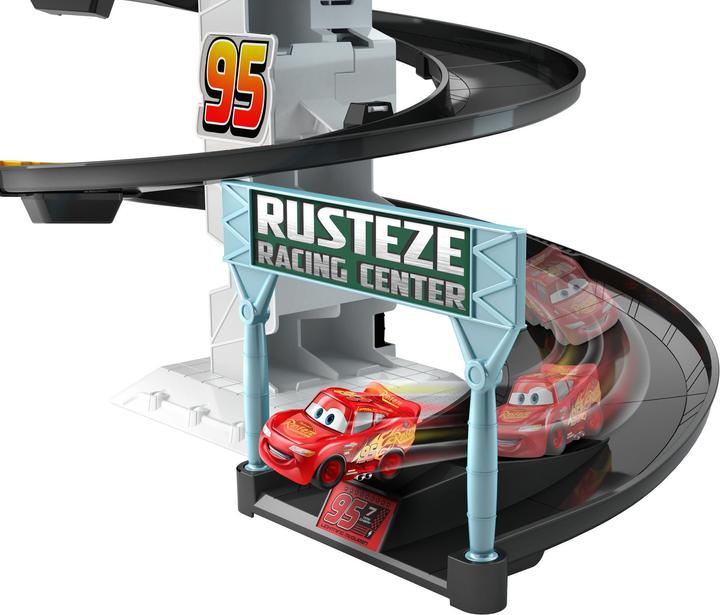 Produktbild Hot Wheels Disney Cars Rust-Eze Dreh-Action-Rennbahn Spielset