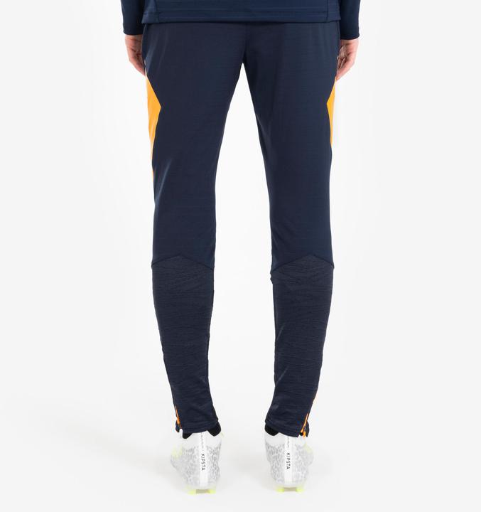 Actual product image Kipsta Women's/men's football training trousers - CLR orange/navy blue (W27)