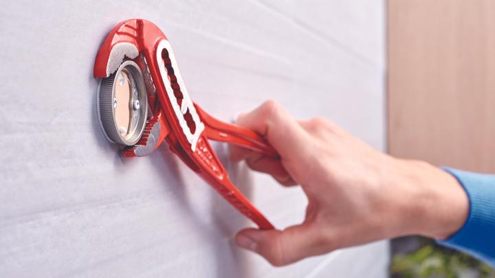Actual product image tesa EKKRO hairdryer holder incl. adhesive solution without drilling