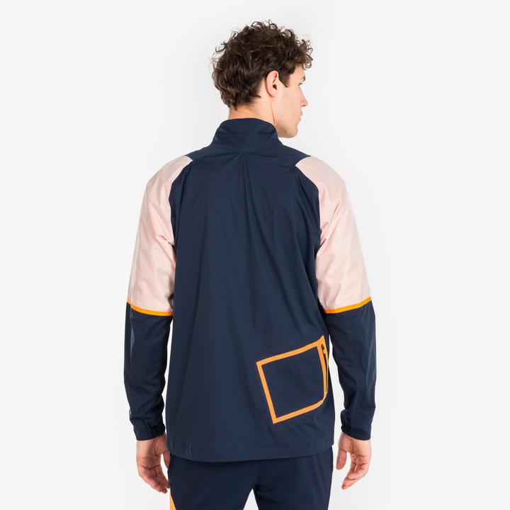 Produktbild Kipsta Damen/Herren Fussball Regenjacke - CLR marineblau/orange (XS)
