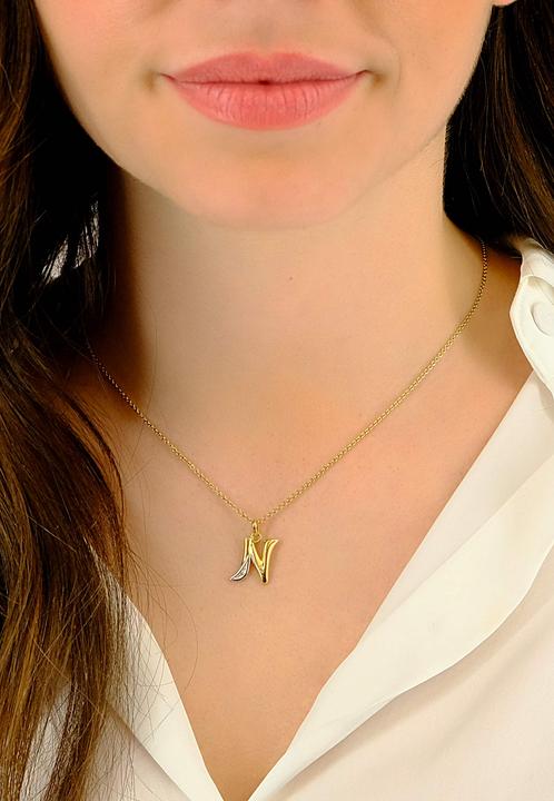 Actual product image Muau Letter (750/18 K Yellow gold)