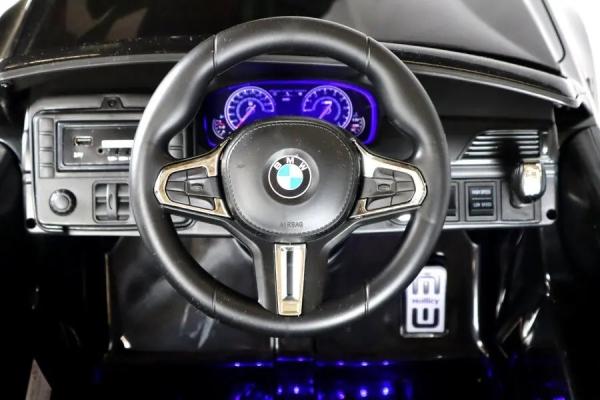 Produktbild Es-toys Elektro Kinderfahrzeug “BMW M5” – lizenziert – 24V Akku,MP3, Ledersitz + EVA - Schwarz (24 V)