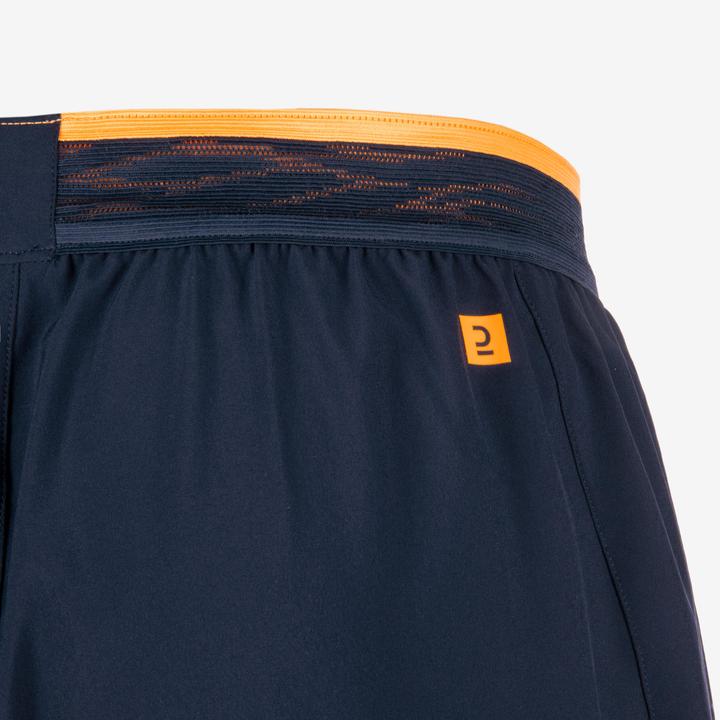 Immagine prodotto Kipsta Pantaloncini da calcio da donna/uomo - CLR blu navy/arancio (L)