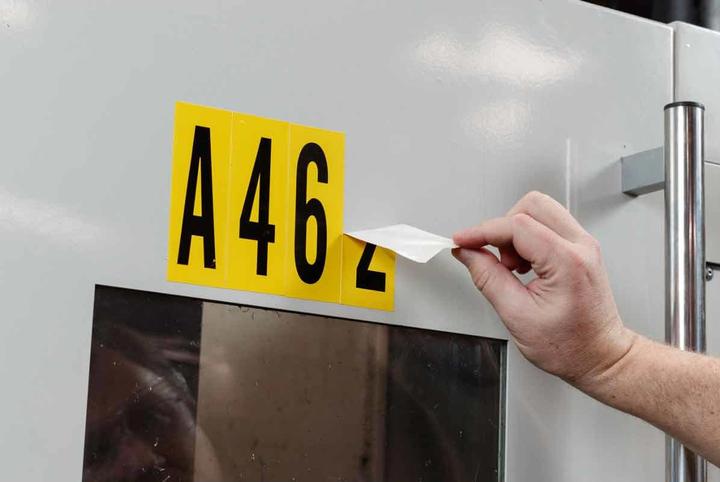 Actual product image Brady B-946, 1570-# Kit, Vinyl, Lettering: Number Set (0-9), Black on Yellow, 127 x 228mm, Sch
