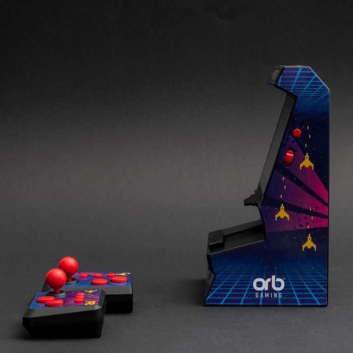 Immagine prodotto ORB - Mini Arcade Machine mit Dual-Controller - inkl. 300x 8-bit Spielen