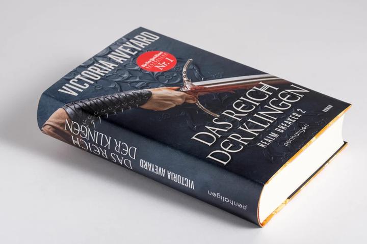 Immagine prodotto Das Reich der Klingen - Realm Breaker 2 (Tedesco, Victoria Aveyard, 2022)