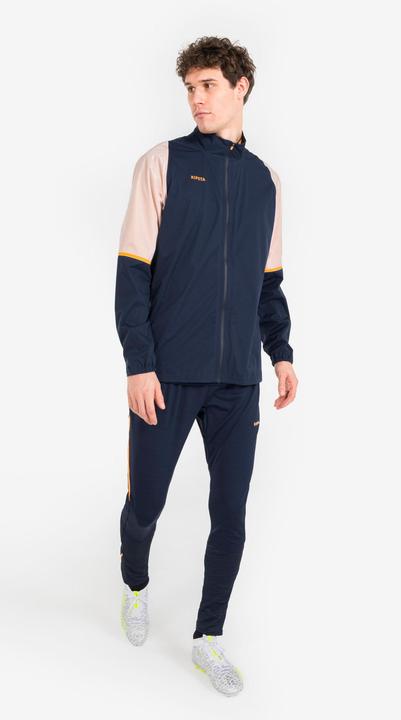 Produktbild Kipsta Damen/Herren Fussball Regenjacke - CLR marineblau/orange (XS)