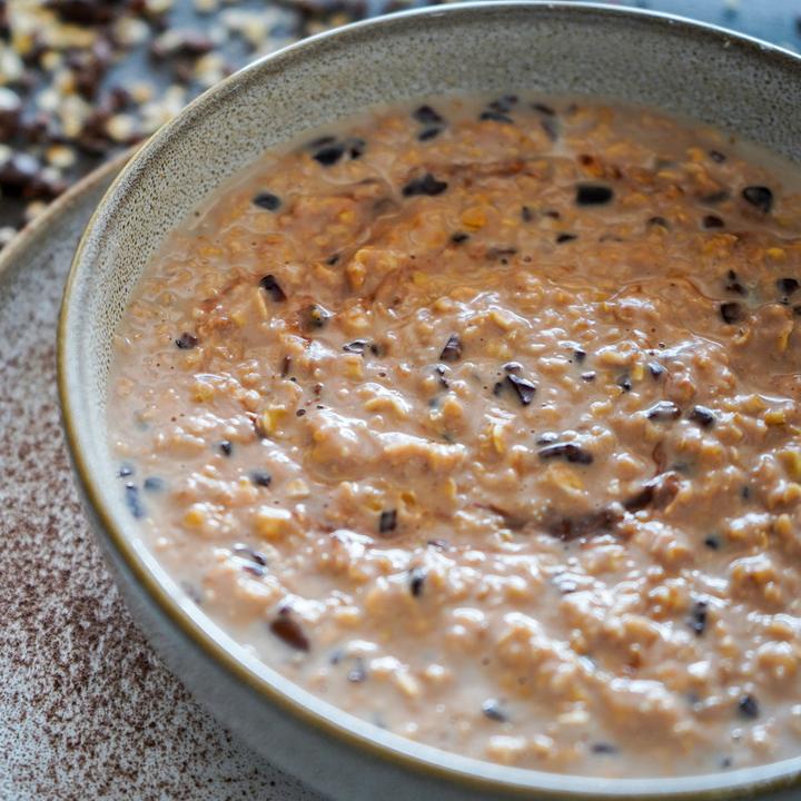 Actual product image BE THE CHANGE Protein Porridge BIO Swiss Chocolate Cacao Nibs (540 g)