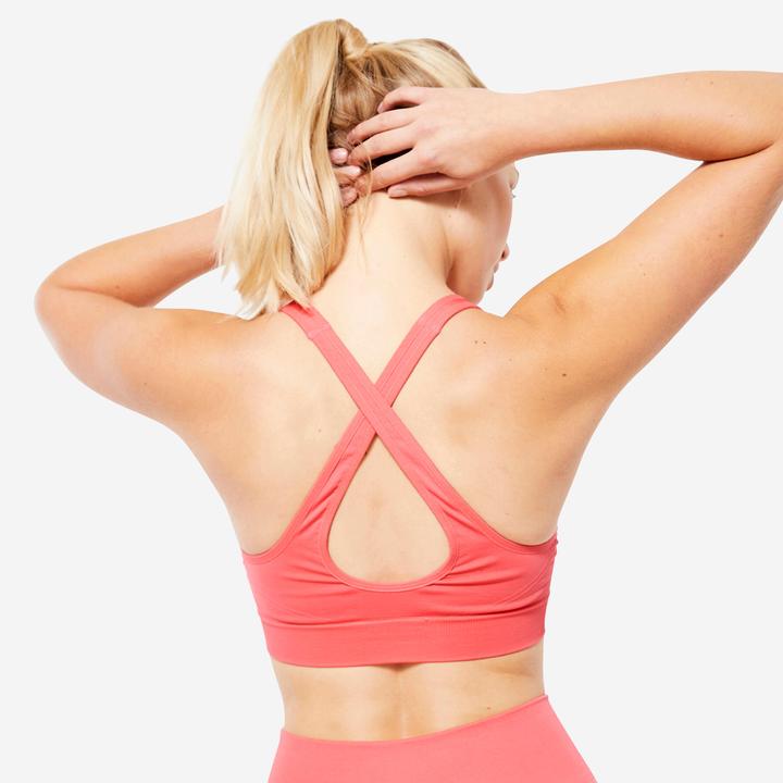 Immagine prodotto Decathlon Reggiseno sportivo leggero con spalline incrociate - rosa (S)