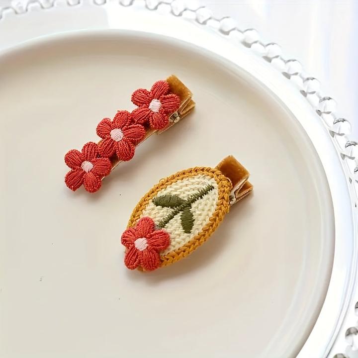 Activity Board Gestrickte rote Blume Haarspange