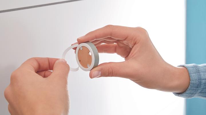 Actual product image tesa MOON hairdryer holder incl. adhesive solution without drilling