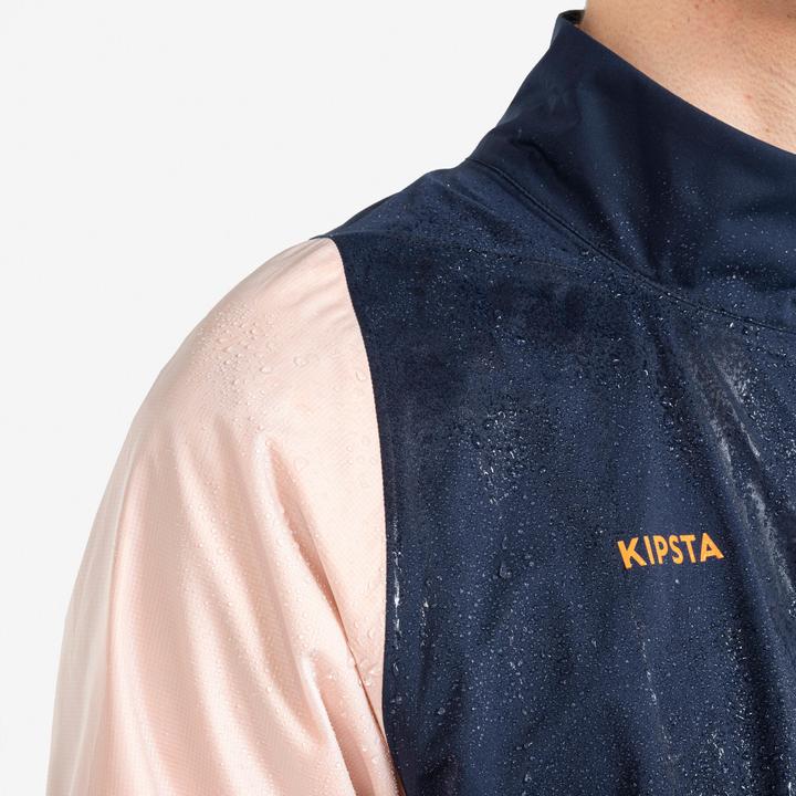 Produktbild Kipsta Damen/Herren Fussball Regenjacke - CLR marineblau/orange (XS)