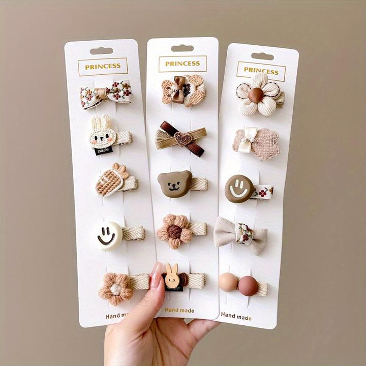 Immagine prodotto Activity Board 15/20pz simpatici fermagli per capelli a fiocco con faccia sorridente di animali dei cartoni (20 pz.)