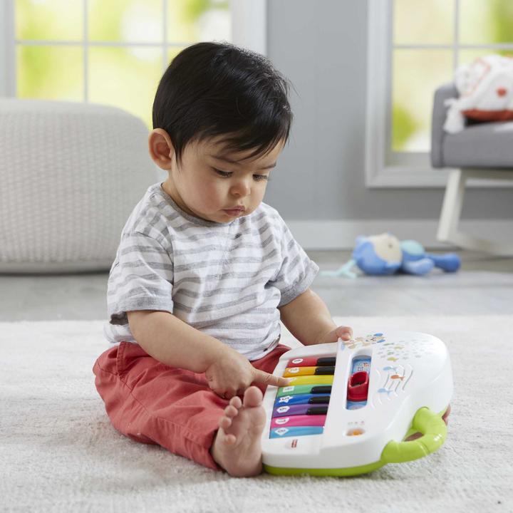 Produktbild Fisher-Price Doggie Piano Laugh & Learn Multilingual Edition, tragbar mit Lichtern, Strophen d