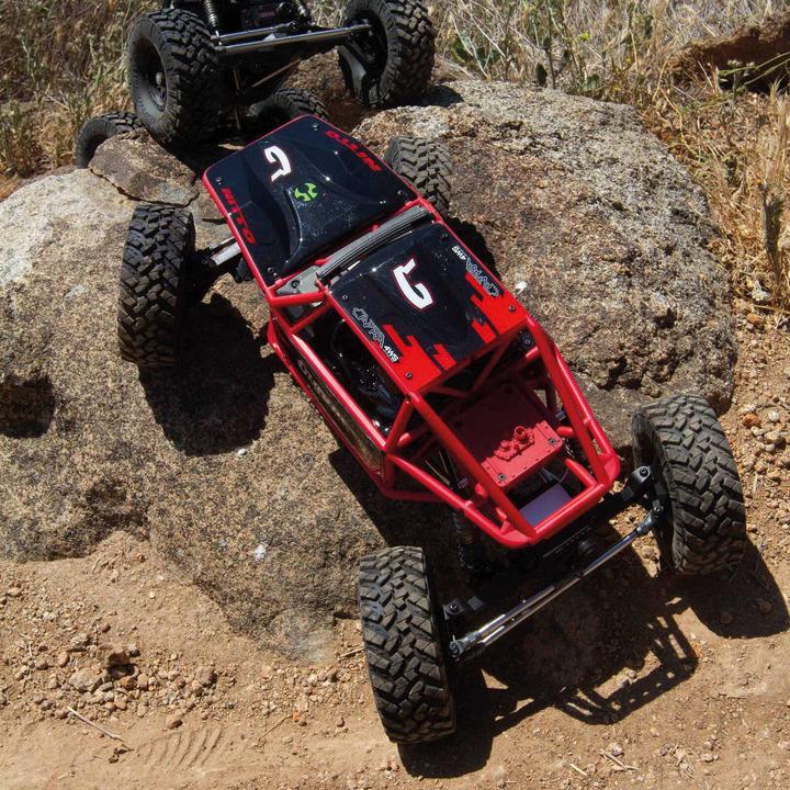 Actual product image Axial Capra 1.9 Unlimited Trail Buggy Electric Brushed Crawler 4WD 1:8 RTR Red (RTR Ready-to-Run)