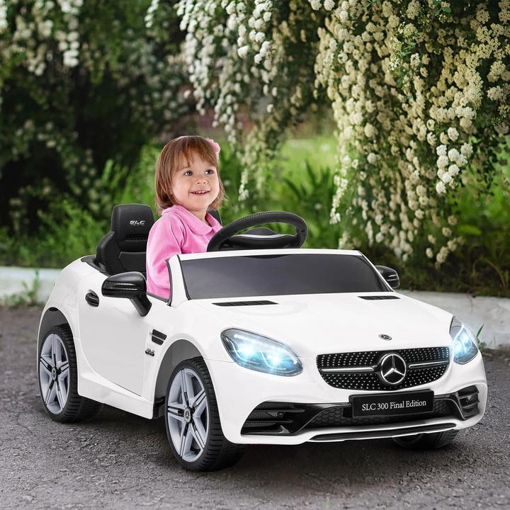 Immagine prodotto Swisshandel24 Auto elettrica per bambini, telecomando, cintura di sicurezza, musica, da 3 anni, bianco (12 V)