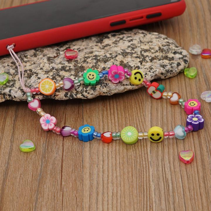 Produktbild PhoneLook Universal Smartphone Armband Schmuck Charms Blumen Früchte und Emojis Perlenband