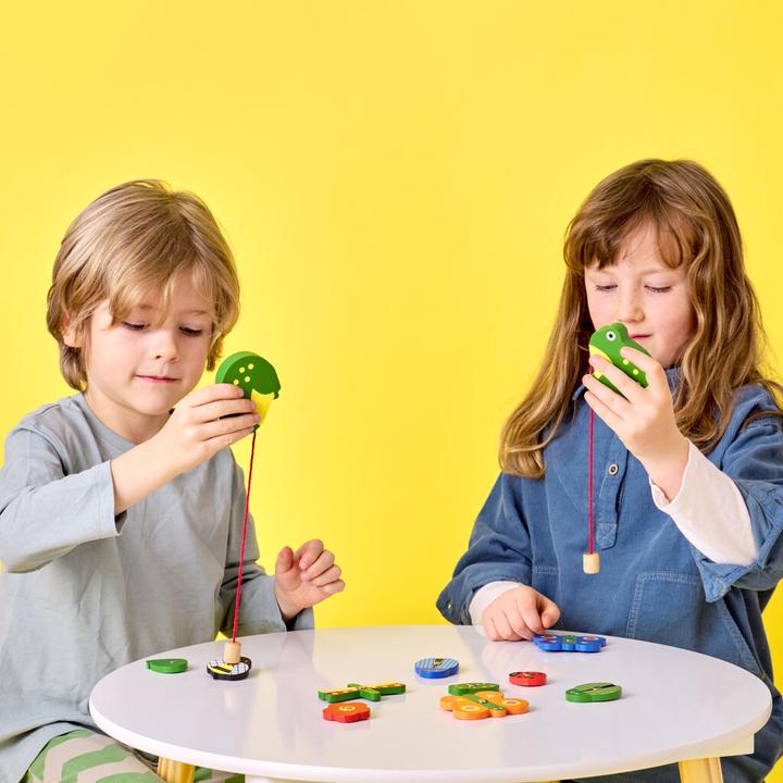 Actual product image Kikkerland Catch a Bug Wooden Fishing Game (French, German, Portuguese, Spanish, Dutch, Italian, Icelandic, English)