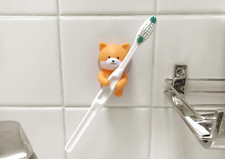 Actual product image Kikkerland Dog Zahnbürstenhalter (Toothbrush holder)