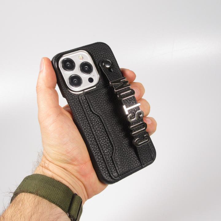 Immagine prodotto PhoneLook Copertina Copertina in pelle personalizzata con scritte in argento + cordino e scomparto per le (Apple iPhone 15 Pro)