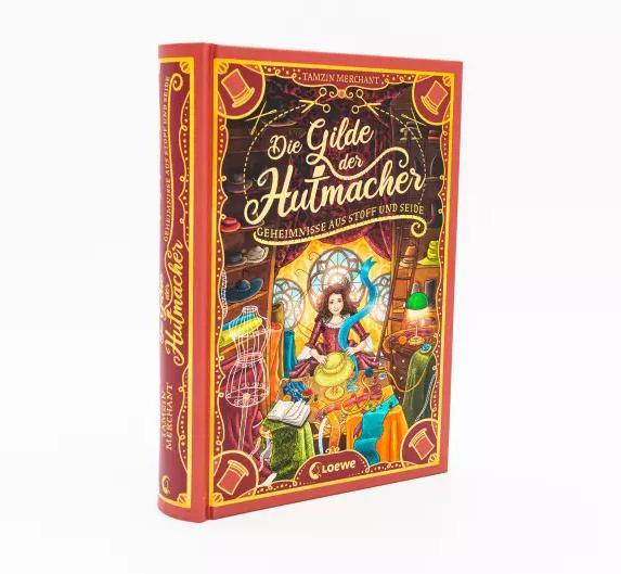 Immagine prodotto Die Gilde der Hutmacher (Die magischen Gilden, Band 1) - Geheimnisse aus Stoff und Seide (Tedesco, Tamzin Merchant, Paola Escobar, Nadine Mannchen, 2022)