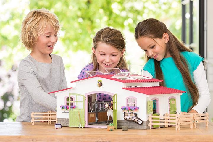 Produktbild Schleich Reiterhof mit Reiterin und Pferden