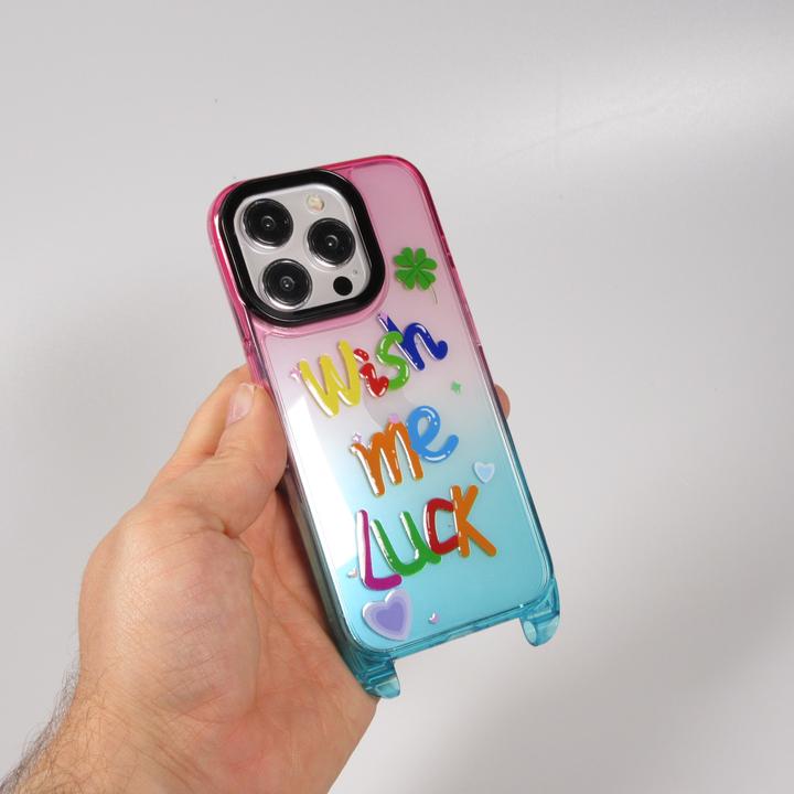 Immagine prodotto PhoneLook Coperchio in gomma trasparente WISH ME LUCK con gancio per cordino (senza cordino) /blu (Apple iPhone 15 Pro Max)