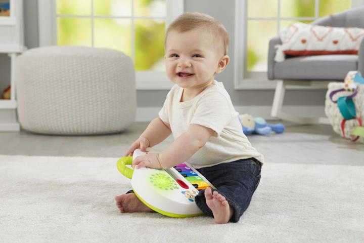 Produktbild Fisher-Price Doggie Piano Laugh & Learn Multilingual Edition, tragbar mit Lichtern, Strophen d