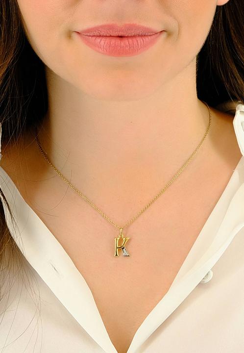 Actual product image Muau Letter (750/18 K Yellow gold)