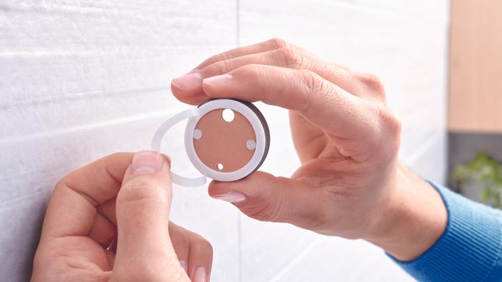 Actual product image tesa EKKRO hairdryer holder incl. adhesive solution without drilling