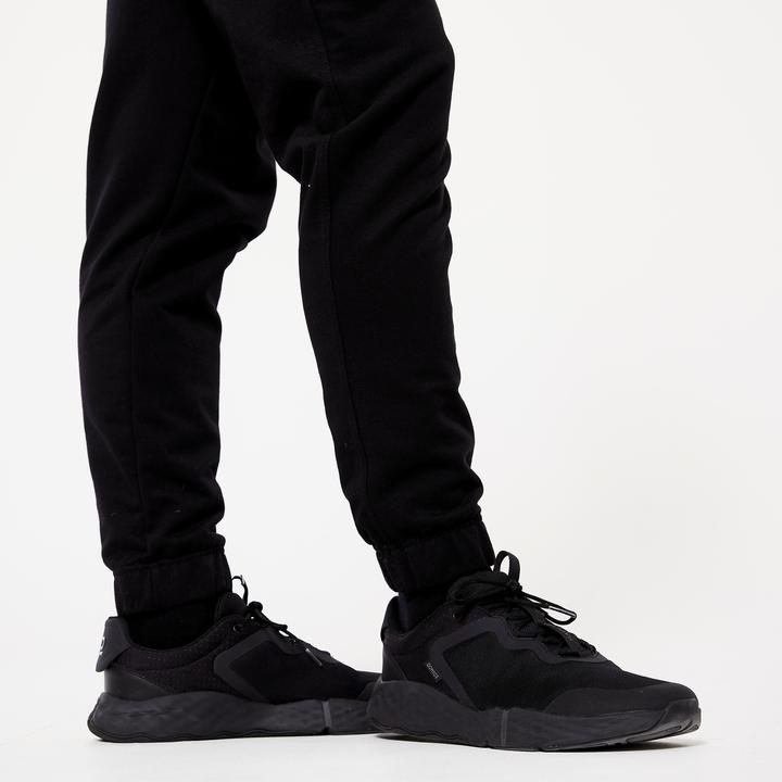 Domyos Jogginghose Herren warm - 100 schwarz (W34/L34)