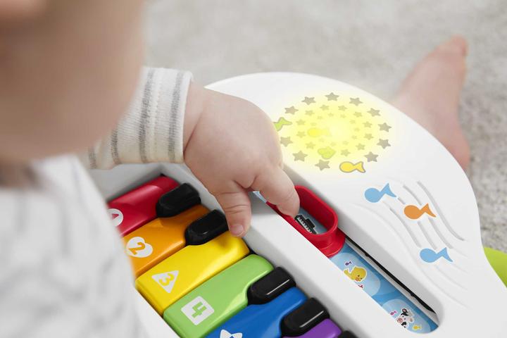 Produktbild Fisher-Price Doggie Piano Laugh & Learn Multilingual Edition, tragbar mit Lichtern, Strophen d